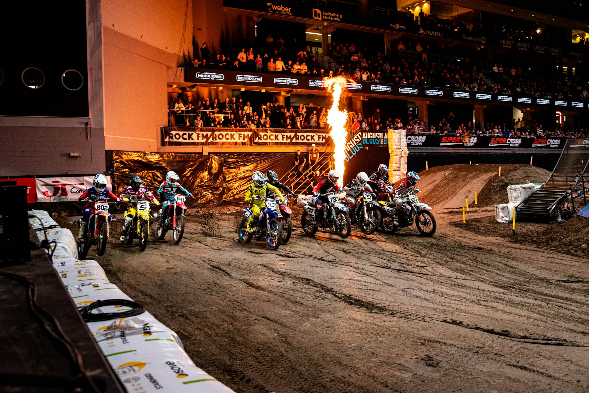Supercross stadium race start with pyrotechnic flames